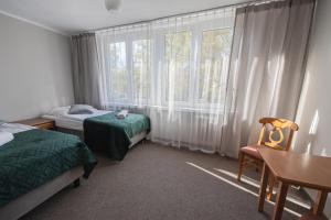 Postel nebo postele na pokoji v ubytování Hotel Felix