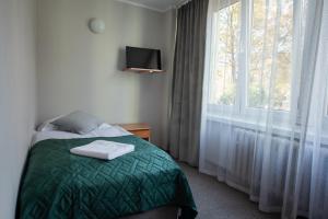 Postel nebo postele na pokoji v ubytování Hotel Felix