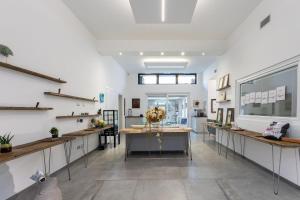 a room with white walls and wooden countertops at Little Square Arona in Arona