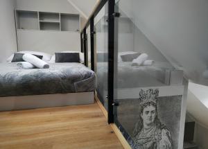 Posteľ alebo postele v izbe v ubytovaní Hugo VIP Apartments