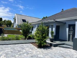 a house with two trees in front of it at 28 on Symonds Luxstudio 2 in George