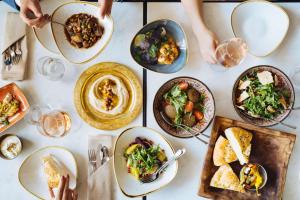 a table with plates of food on it at Hyatt Regency Zurich Airport Circle in Kloten