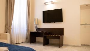 Uma televisão e/ou sistema de entretenimento em Apollo Suites