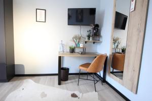 TV a/nebo společenská místnost v ubytování zeitlos Hotel und Restaurant am Fuchsbach