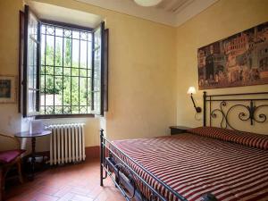 Postel nebo postele na pokoji v ubytování Villa Rosa Panzano + 30 fotografií