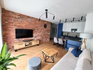 Posezení v ubytování Kima Apartament Bażantów 44