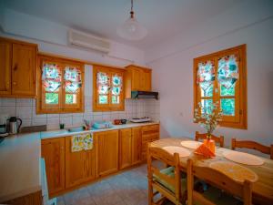 A kitchen or kitchenette at Orange House for big families in Damouchari - Delicious Houses