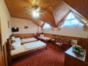 Postel nebo postele na pokoji v ubytování garni Hotel ASAS***