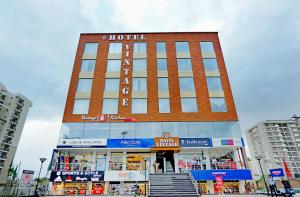 a building with a hotel on top of it at Hotel Vintage Zirakpur Chandigarh in Panchkula