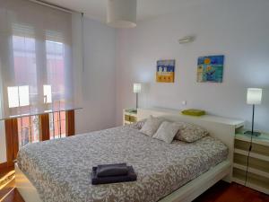 Postel nebo postele na pokoji v ubytování La Casita de Diana Ramales, plaza garaje incluida