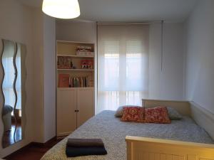 Postel nebo postele na pokoji v ubytování La Casita de Diana Ramales, plaza garaje incluida