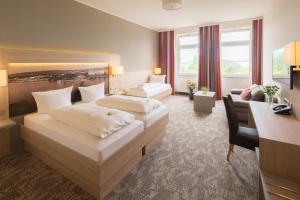 Postel nebo postele na pokoji v ubytování Best Western Hotel Dreiländerbrücke Weil am Rhein / Basel