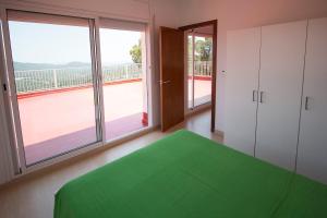 A bed or beds in a room at Catalunya Casas Fun and Frolic in Lloret del Mar 3500 meters to beach!