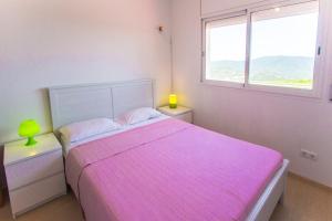 A bed or beds in a room at Catalunya Casas Fun and Frolic in Lloret del Mar 3500 meters to beach!