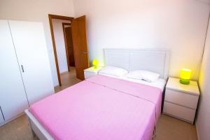 A bed or beds in a room at Catalunya Casas Fun and Frolic in Lloret del Mar 3500 meters to beach!
