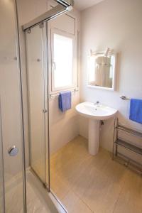 a bathroom with a sink and a shower at Catalunya Casas Fun and Frolic in Lloret del Mar 3500 meters to beach! in Lloret de Mar