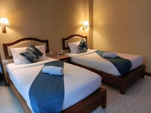 Postel nebo postele na pokoji v ubytování Lalisa Hotel Aonang