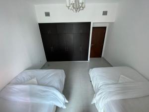 Postel nebo postele na pokoji v ubytování Wonderful Rooms ' for girls only ' in Dubai TECOM, Al Barsha