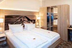 Postel nebo postele na pokoji v ubytování Best Western Hotel Dreiländerbrücke Weil am Rhein / Basel
