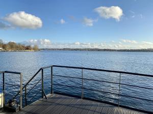 a boat on a large body of water at Island-dreams Hausboote Groth & Rhin in Schleswig