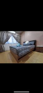 Ліжко або ліжка в номері A Spacious 3BR 2storey House Taman Kosas Ampang