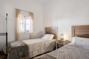 Postel nebo postele na pokoji v ubytování Los Olivos + 16 fotografií