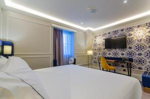 Télévision ou salle de divertissement dans l'établissement Eurostars Lisboa Baixa