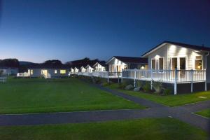 a house with a lawn in front of it at Croyde Bay Hotel or Self Catering in Croyde
