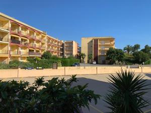 a parking lot in front of a apartment building at WASELA 114 in Palamós