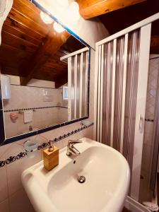 a bathroom with a sink and a mirror at JP House Amalfi in Amalfi