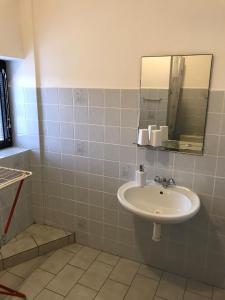 a bathroom with a sink and a mirror at Apartmán Šírovi in Benecko