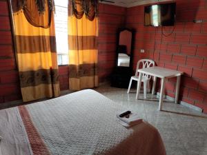 Postel nebo postele na pokoji v ubytování Casa Hotel Los Faroles- Samaná/Caldas
