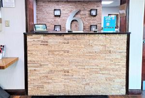 a brick wall with a large letter k on it at Suites Catonsville MD Baltimore West in Catonsville