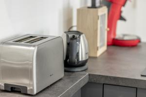 a toaster sitting on top of a kitchen counter at Guest House Maccarani in Nice