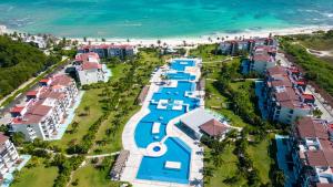 an aerial view of a resort next to the ocean at Stunning Ocean Front By Condo Boutique in Playa del Carmen +204 photos