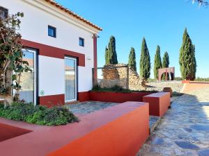 a villa with aiterraneaniterraneaniterranean climate and a driveway at Naturarte Rio - Duna Parque Group in Vila Nova de Milfontes