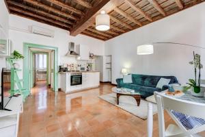 a living room with a couch and a table at The Unique Home Pantheon in Rome