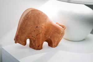 a cookie shaped like a bear sitting next to a vase at Apartamenty Gołębia 3 in Krakow +98 photos