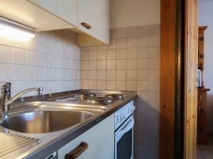 a kitchen with a sink and a counter top at Apartment Christiania 2 O1 by Interhome in Nendaz