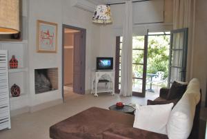 a living room with a couch and a fireplace at Casa Taos in Marrakesh