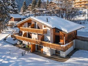 a house with snow on the roof at Apartment Plein Sud 3 by Interhome in Ovronnaz