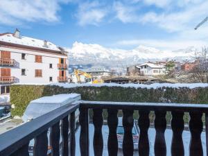 a balcony with a view of snow covered mountains at Apartment L'Orée du Parc by Interhome in Saint-Gervais-les-Bains