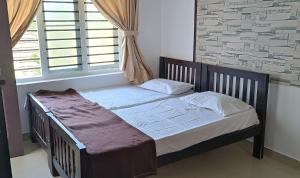 PRAKRITI HOMESTAY Fortkochi Air Conditioned Rooms客房内的一张或多张床位