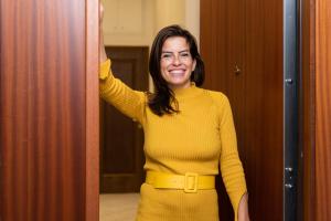 a woman in a yellow sweater and yellow belt at ALE HOUSE in Arezzo
