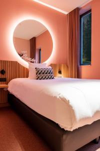 Postel nebo postele na pokoji v ubytování Mah Hotel