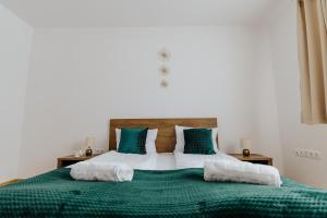 Postel nebo postele na pokoji v ubytování Lotus Apartman II