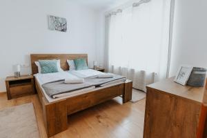 Postel nebo postele na pokoji v ubytování Lotus Apartman II