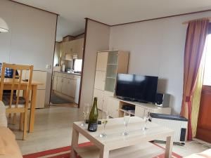 a living room with a table with wine glasses on it at Beach Resort Kamperland - 771 in Kamperland
