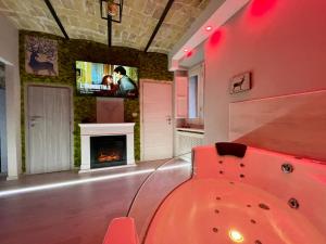 a room with a slide and a fireplace at Old Town Suite in Guardiagrele