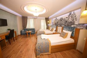 TV a/nebo společenská místnost v ubytování Cumbali Luxury Boutique Hotel